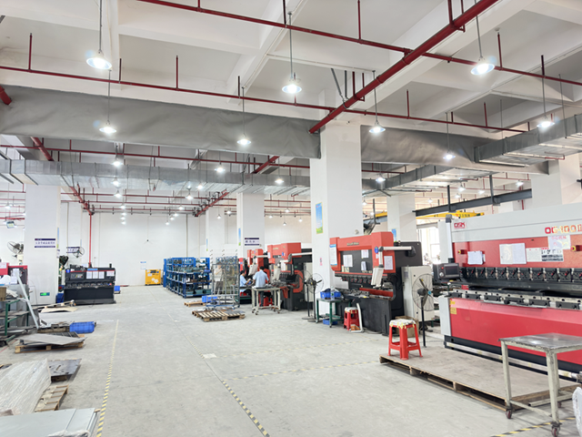 SIWEEP industrial metal bending workshop showcasing precision manufacturing processes with CNC machines.