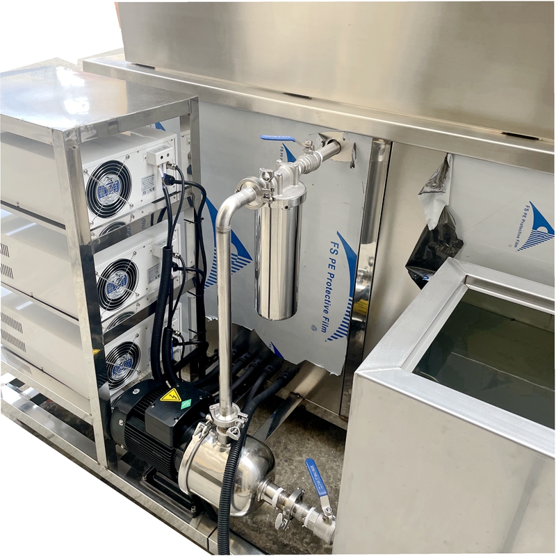 Detailed view of the industrial ultrasonic cleaner filtration housing and replaceable filter element for continuous fluid loop purification