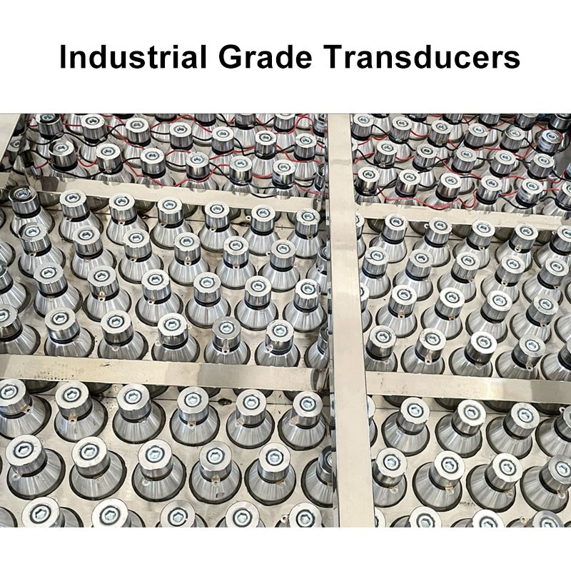 Industrial ultrasonic cleaning machine bottom tank view showing heavy duty transducer arrays for 28kHz and 40kHz cavitation power